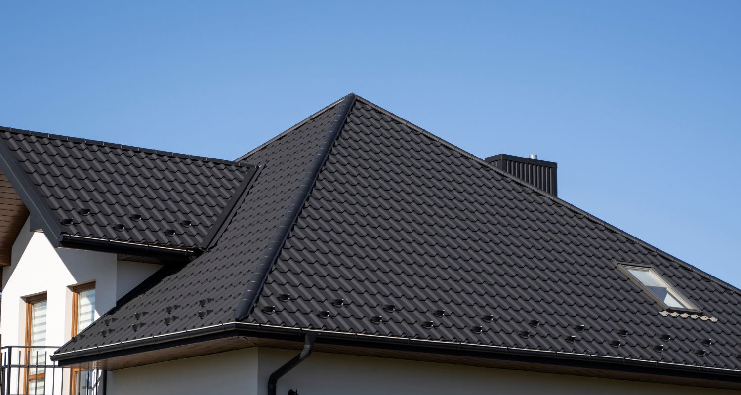 Home with black metal roofing shingles
